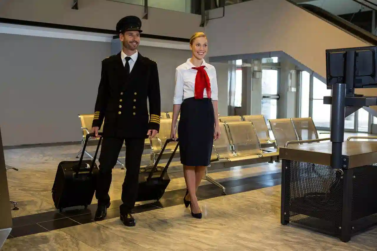 pilot air hostess walking with their trolley bags